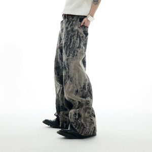 Vintage splatter-distressed straight flare jeans with PU leather patch, showing front view of high-waisted design