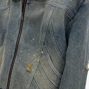 Close-up of artisan distressing showing unique vintage wash texture on heavy denim fabric