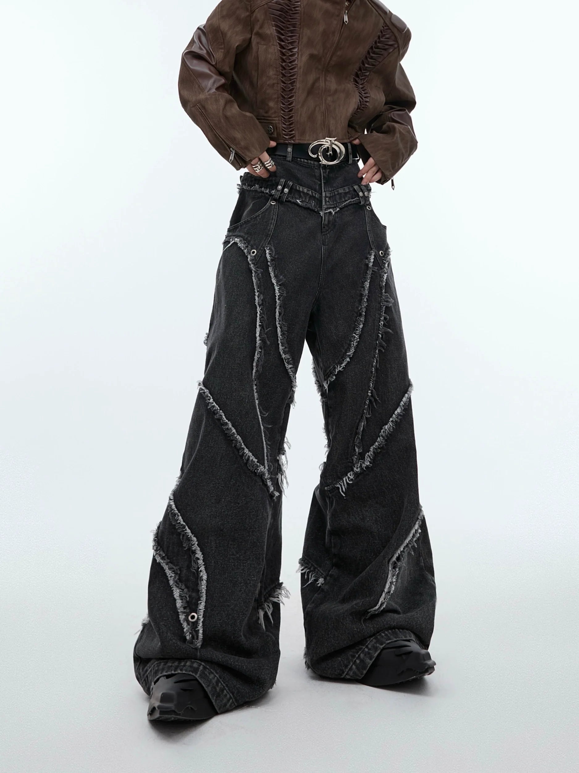 Vintage washed distressed carpenter jeans with raw hem detailing, showcasing the deconstructed workwear aesthetic