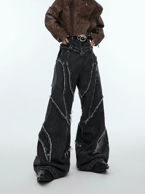 Vintage washed distressed carpenter jeans with raw hem detailing, showcasing the deconstructed workwear aesthetic