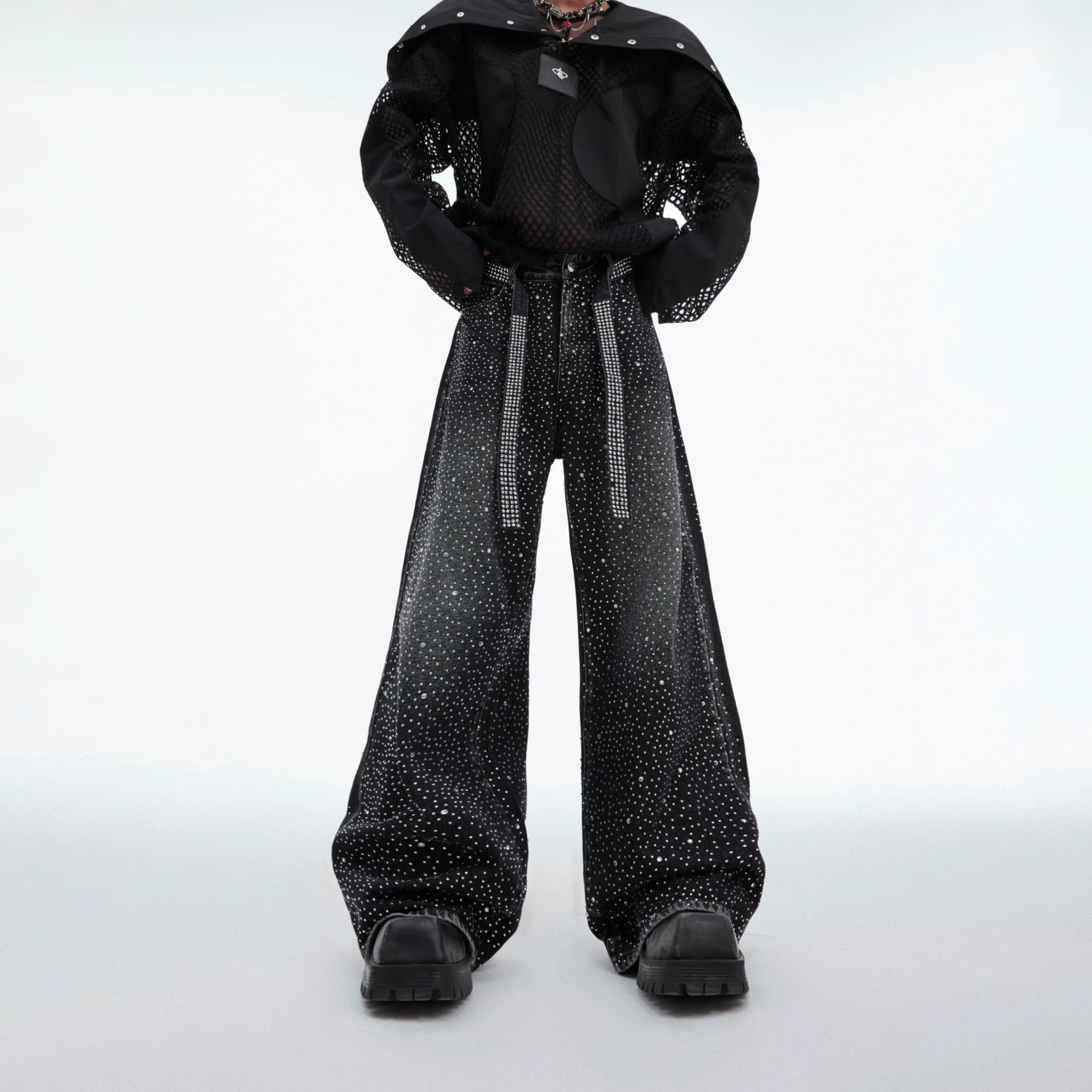 Front view of vintage washed distressed jeans with star embroidery, showing the wide-leg loose fit and deconstructed details