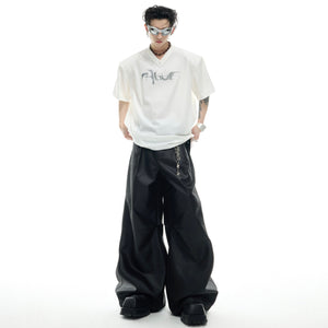 Flat lay fashion shot of deconstructed pearl-trim t-shirt showing full design and urban style