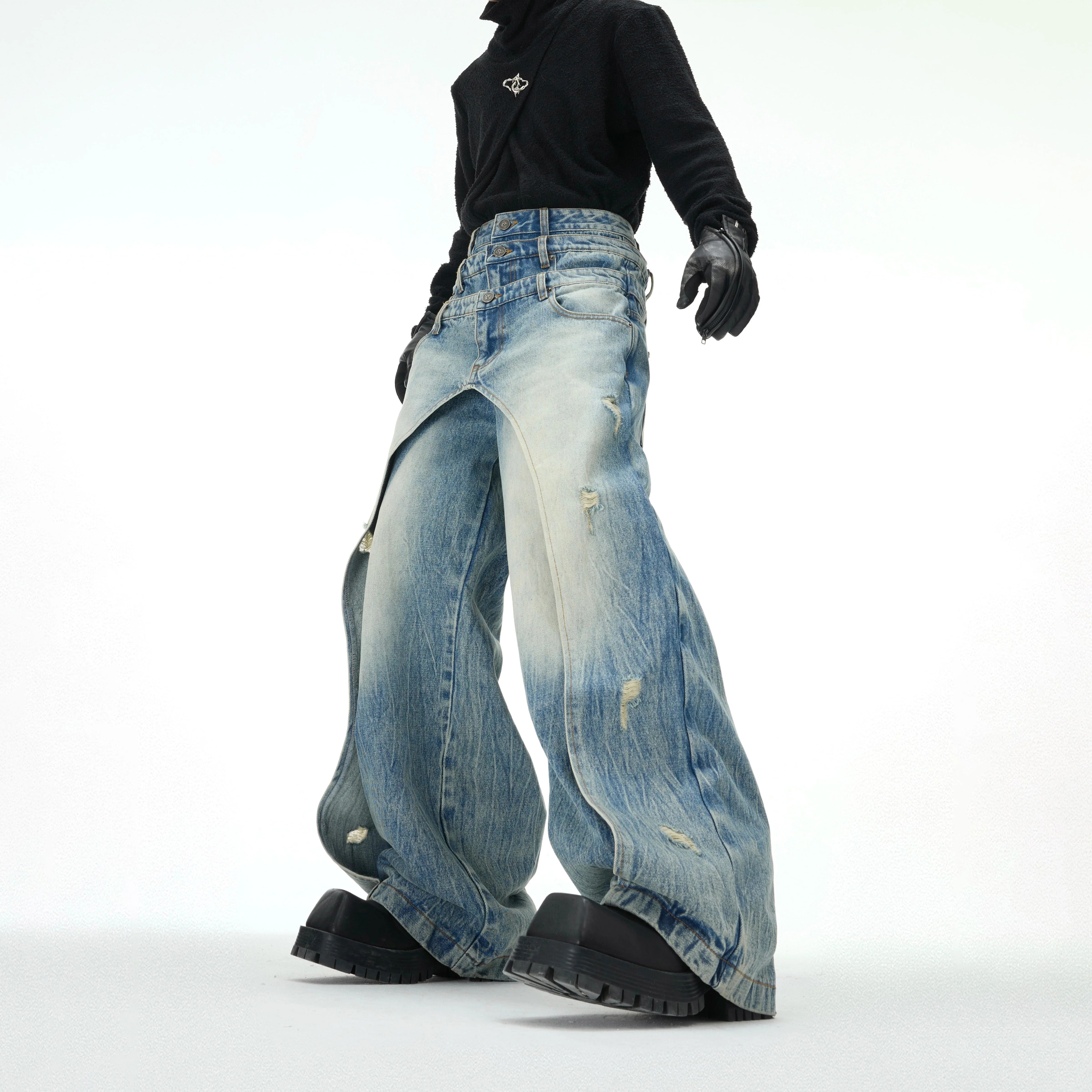 Distressed blue jeans with triple waistband design, featuring authentic vintage wash and streetwear style