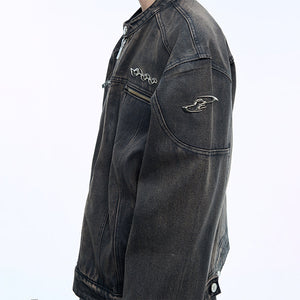 Back view of washed denim jacket featuring quilted short coat design and industrial-style metal accents