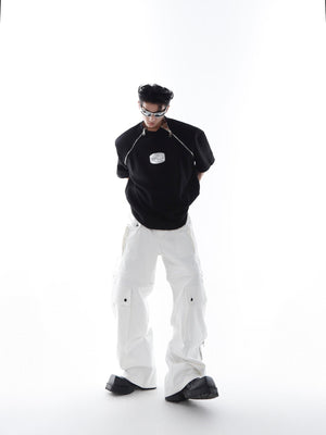 Close-up detail of the structured shoulder pads on this boundary-pushing unisex fashion piece