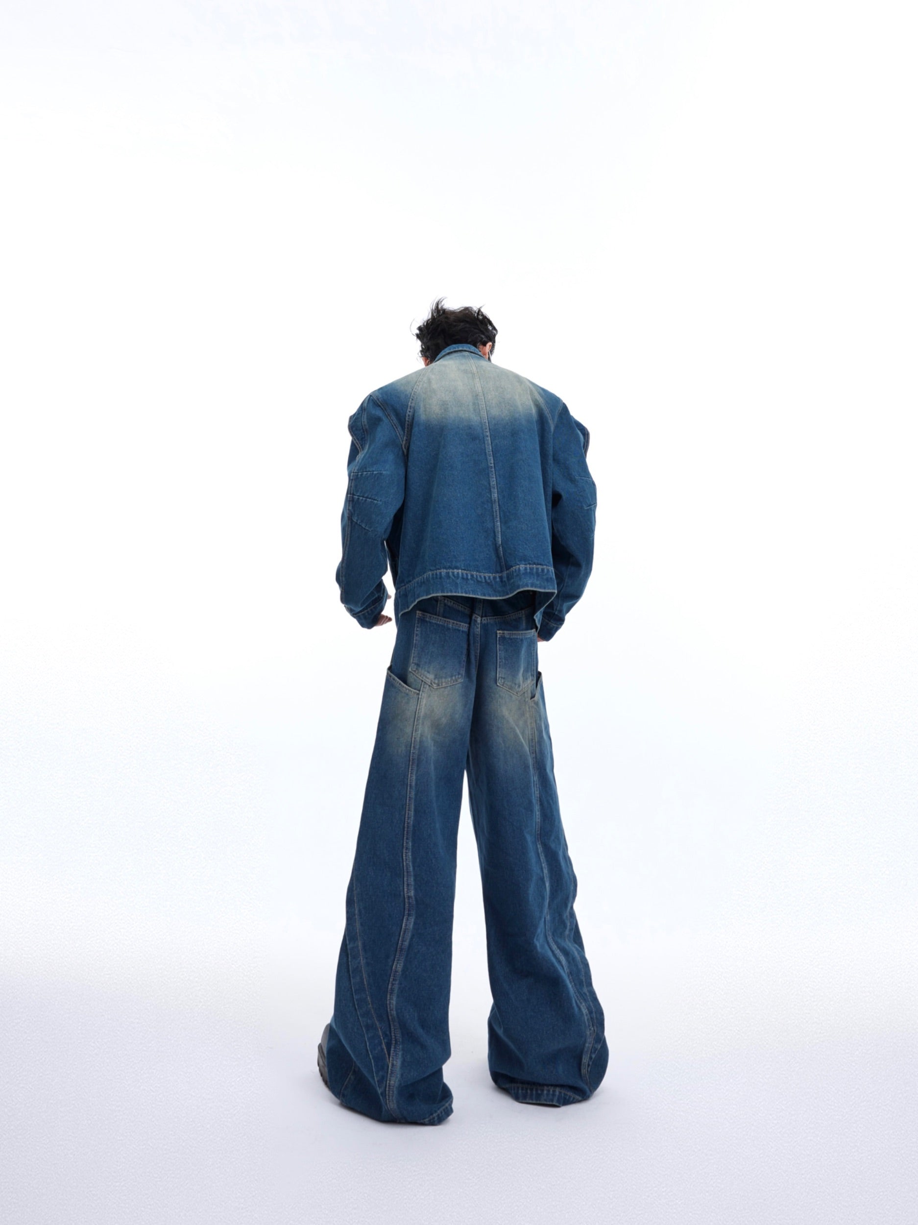 Vintage wide leg denim pants with deconstructed details and artisanal stone wash fading