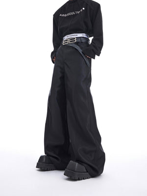 Front view of liquid-shine wide-leg trousers featuring avant-garde metallic patchwork details and loose streetwear fit