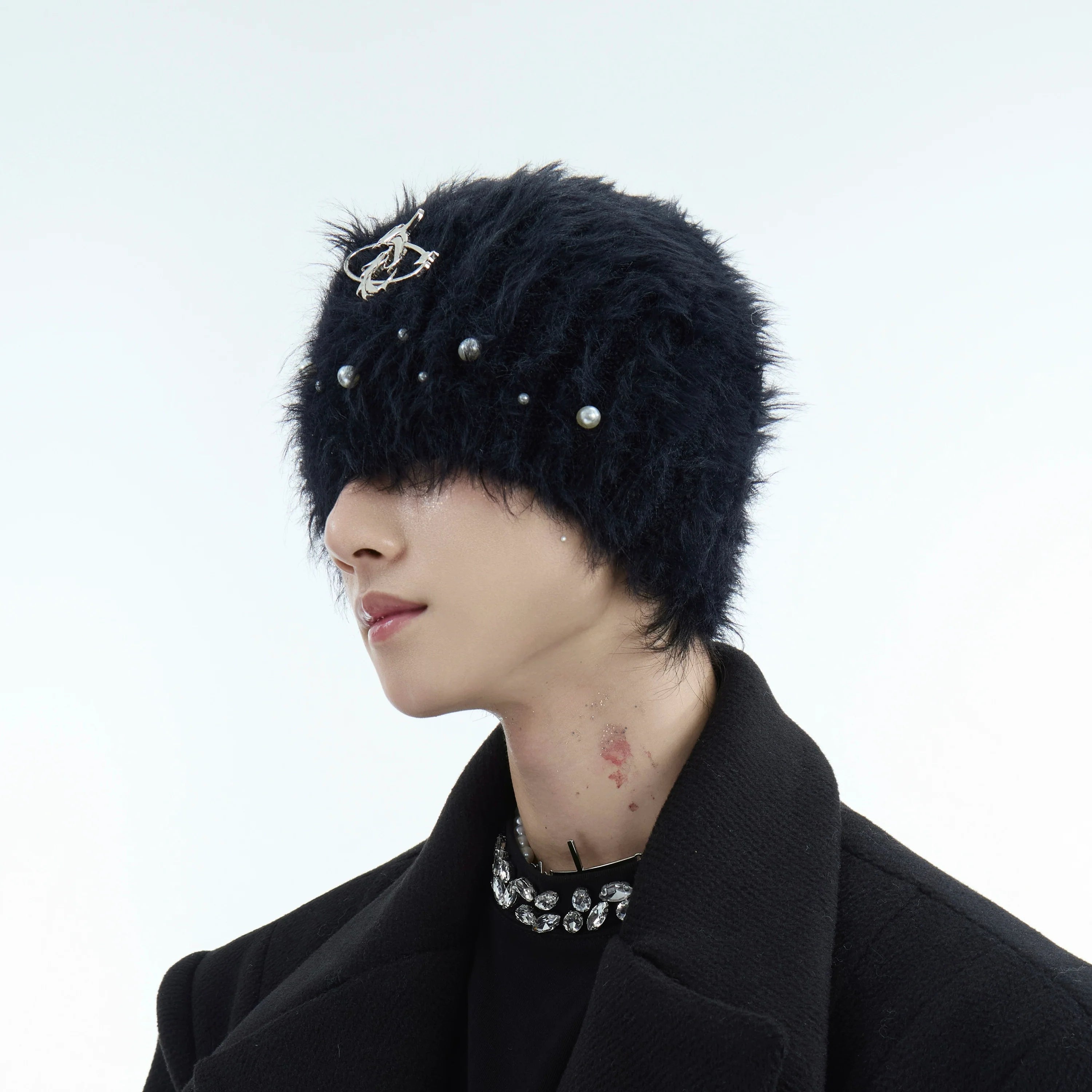 Fluffy knit beanie with pearl decorations, showcasing the winter streetwear style and luxurious mohair texture