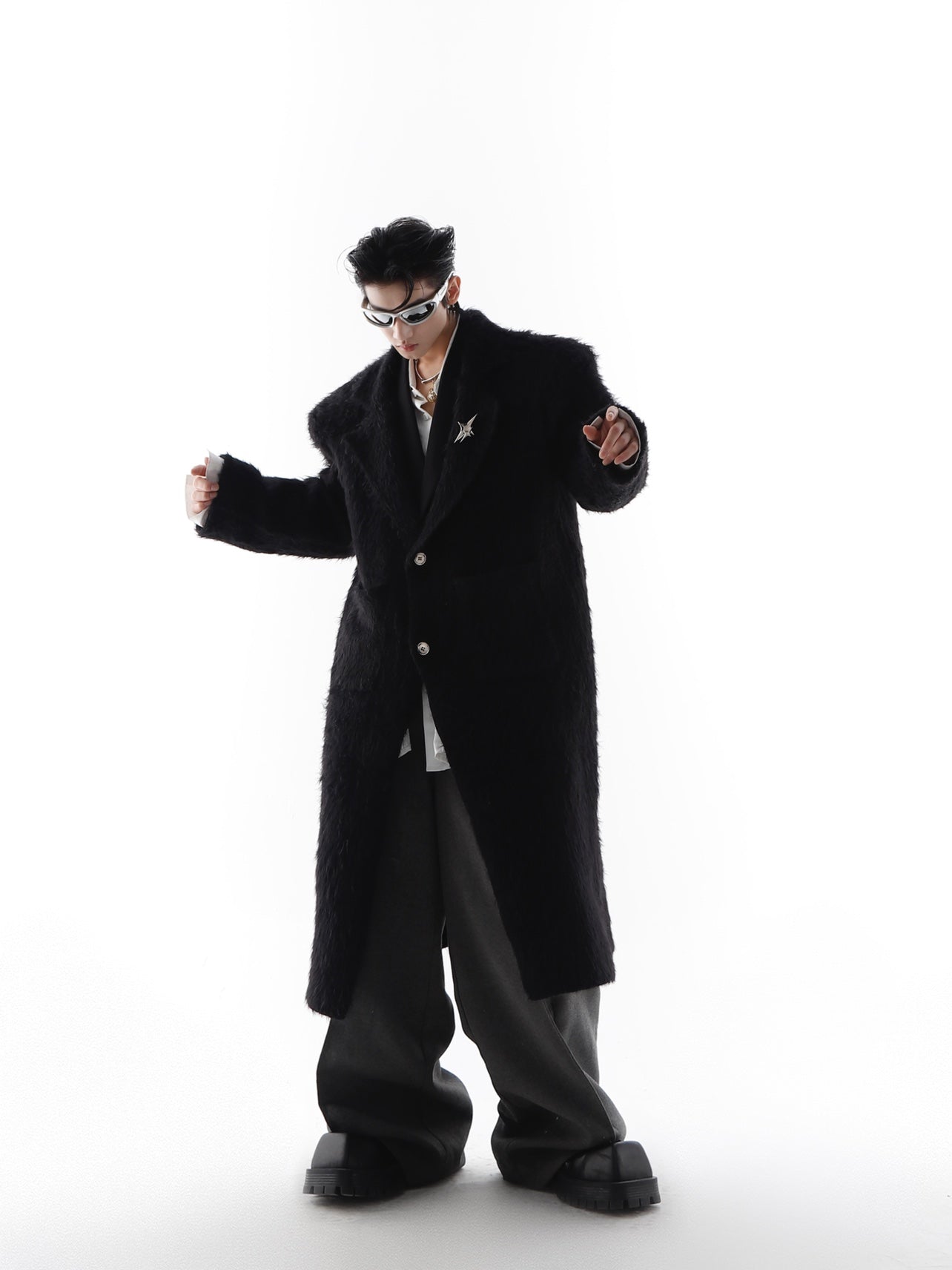 Winter white faux fur trench coat with bold shoulder pads, oversized long coat for avant-garde streetwear style