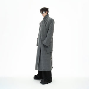 Side profile of the wool blend trench coat highlighting the leather trim and metal strap details