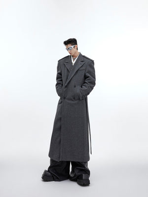 Fashion-forward styling of belted wool overcoat combining streetwear and high fashion aesthetics