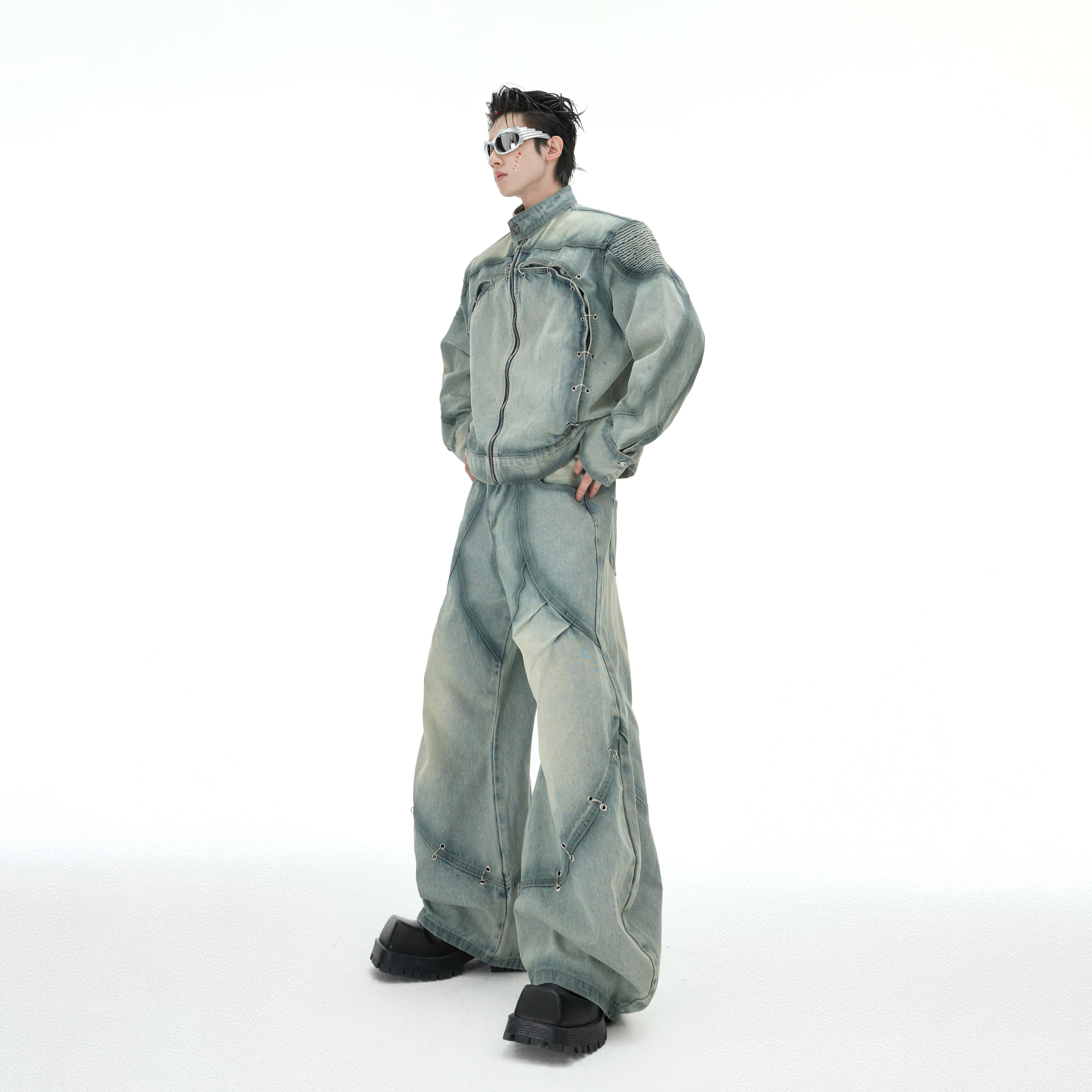 Close-up of the distressed details and vintage wash on this limited edition denim jacket set with functional zipper