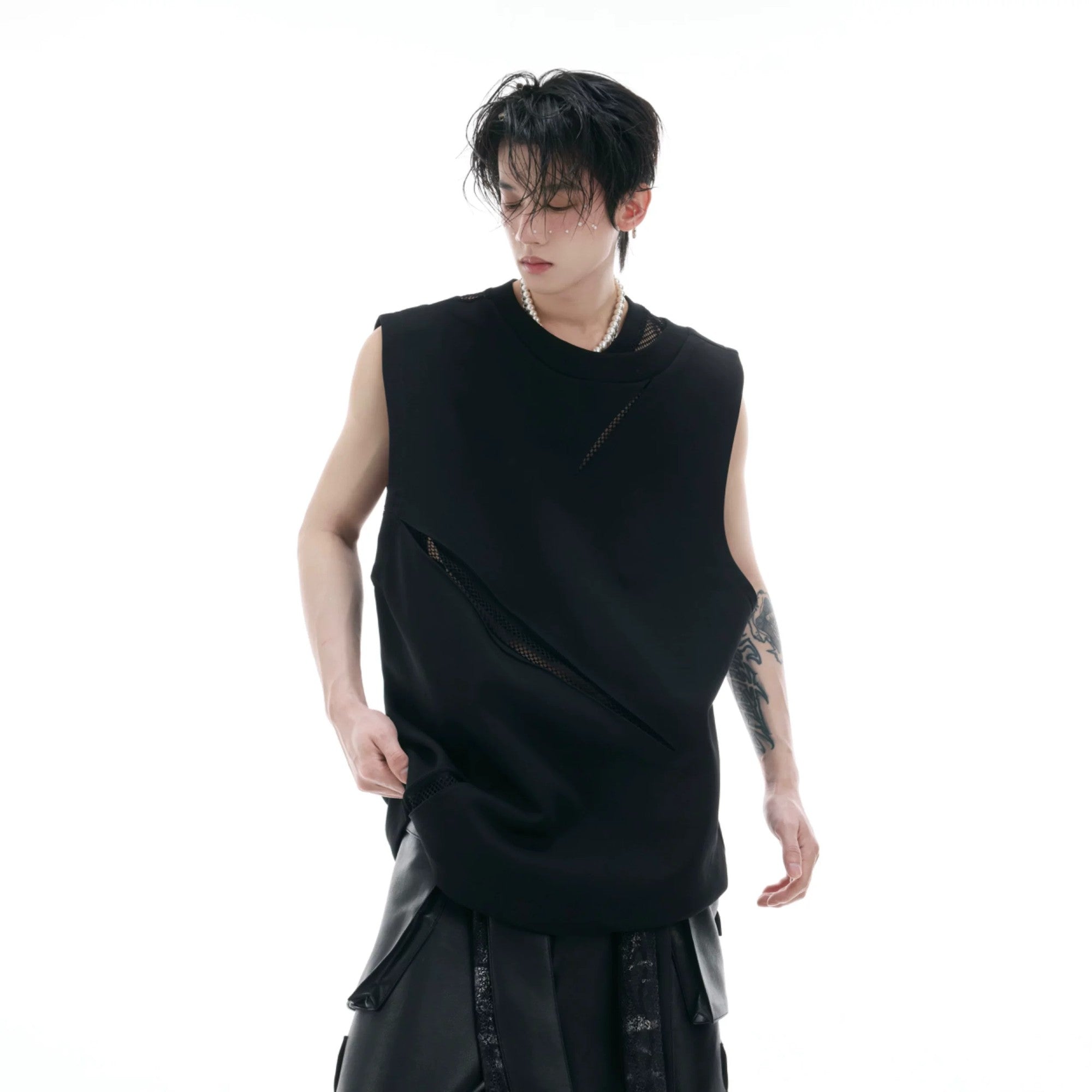 Front view of black mesh cutout sleeveless tank top in slim fit streetwear style
