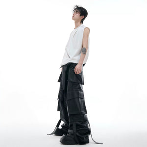 Lifestyle shot of a man wearing a black mesh tank top in a city setting