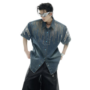 Close-up of mesh paneling and distressed wash on denim short-sleeve jacket