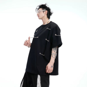 Close up of detachable shoulder pad and metal chain hardware