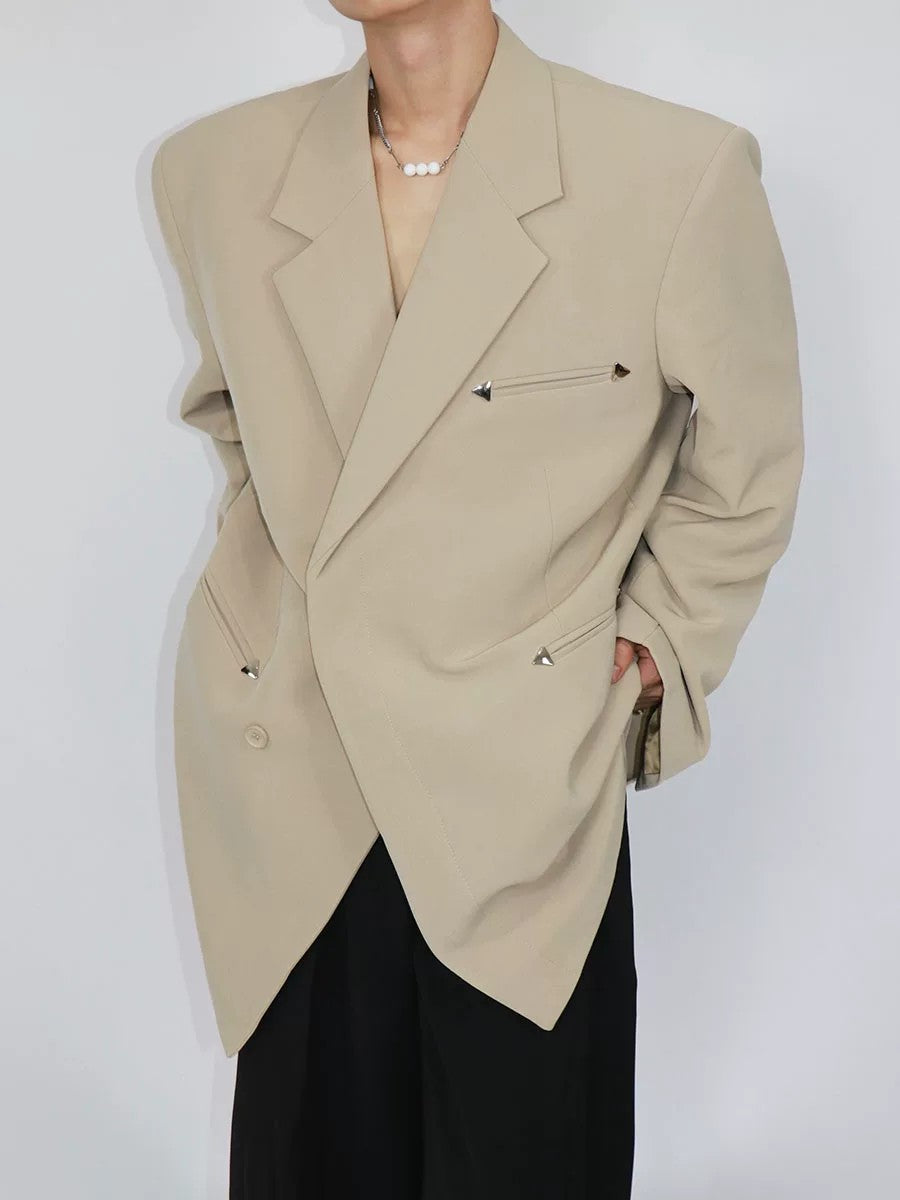Side view showing the structured shoulder pads and loose fit of the blazer