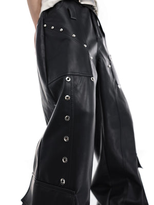 Side view showing oversized utility pockets on black leather pants