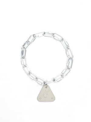 Silver industrial punk necklace displayed on a minimal background