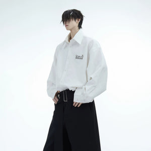 Male model wearing oversized shimmer flame shirt in urban setting