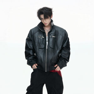 Front view of black distressed oil-waxed vegan leather jacket with multi-zippers