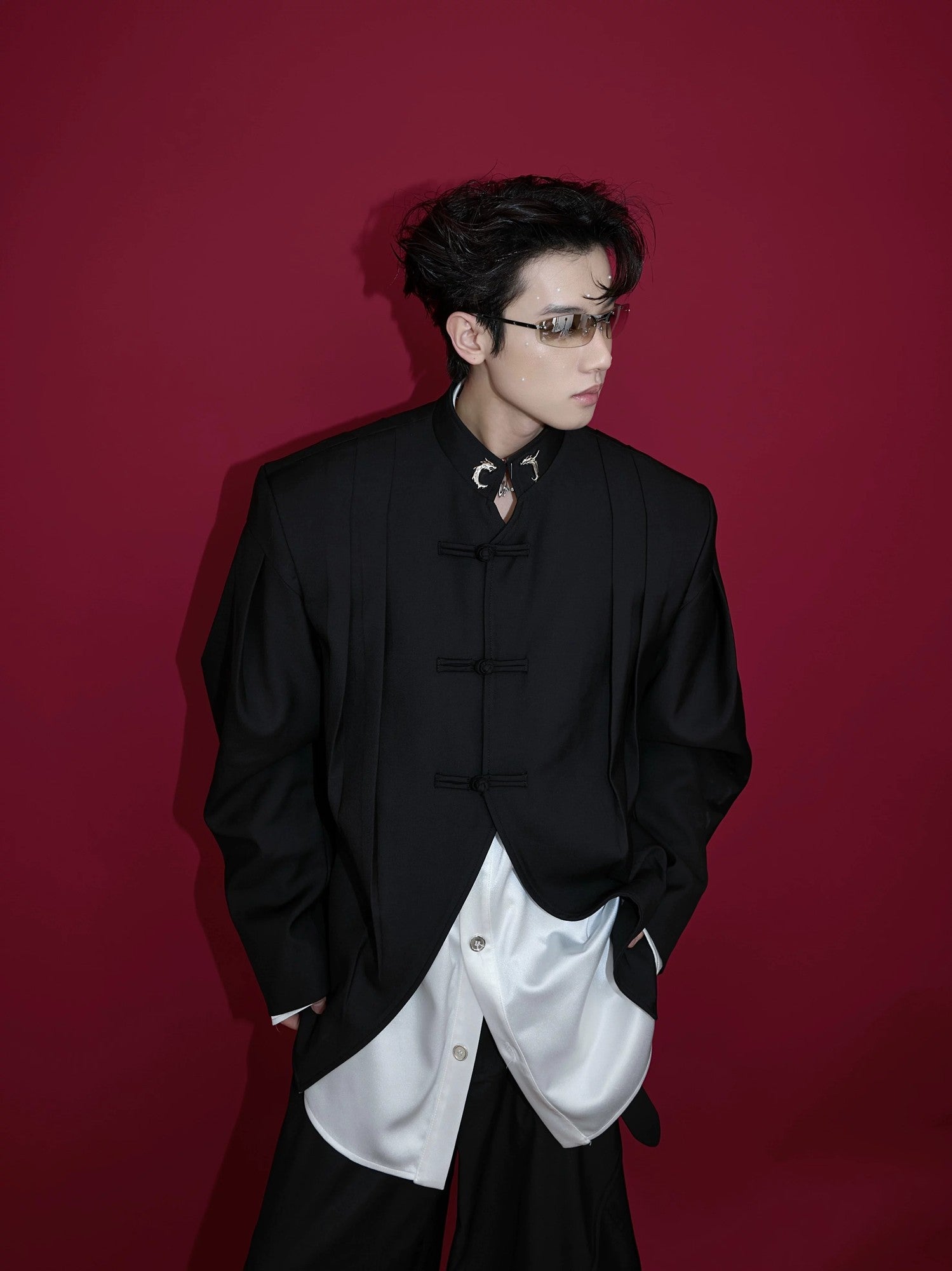 Black Neo-Chinese pleated blazer with traditional frog buttons