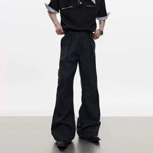 Side view of black flared casual pants showing the bootcut leg opening