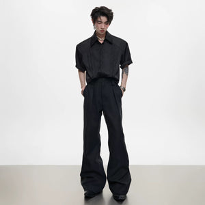 Model wearing flared trousers with loafers for a classic streetwear look