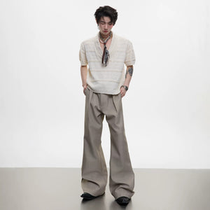 Detailed shot of the custom embroidery on the waist of the trousers