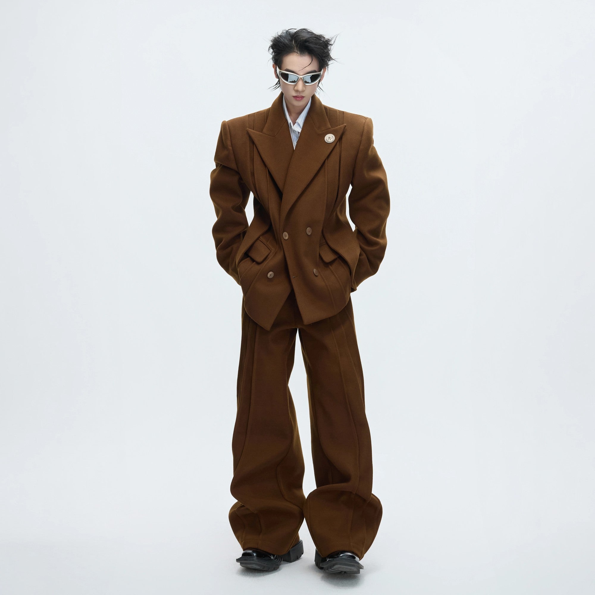 Front view of gray deconstructed wool blazer with cinched waist