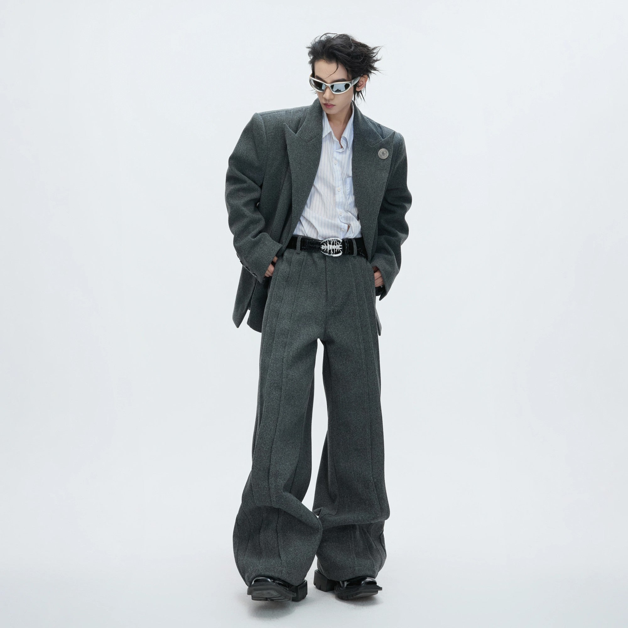 Close up of metal hardware and deconstructed details on wool blazer