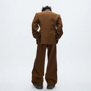 Model wearing brown deconstructed wool suit set in streetwear style