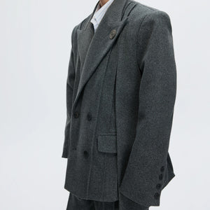 Back view of cinched waist blazer showing double vent design