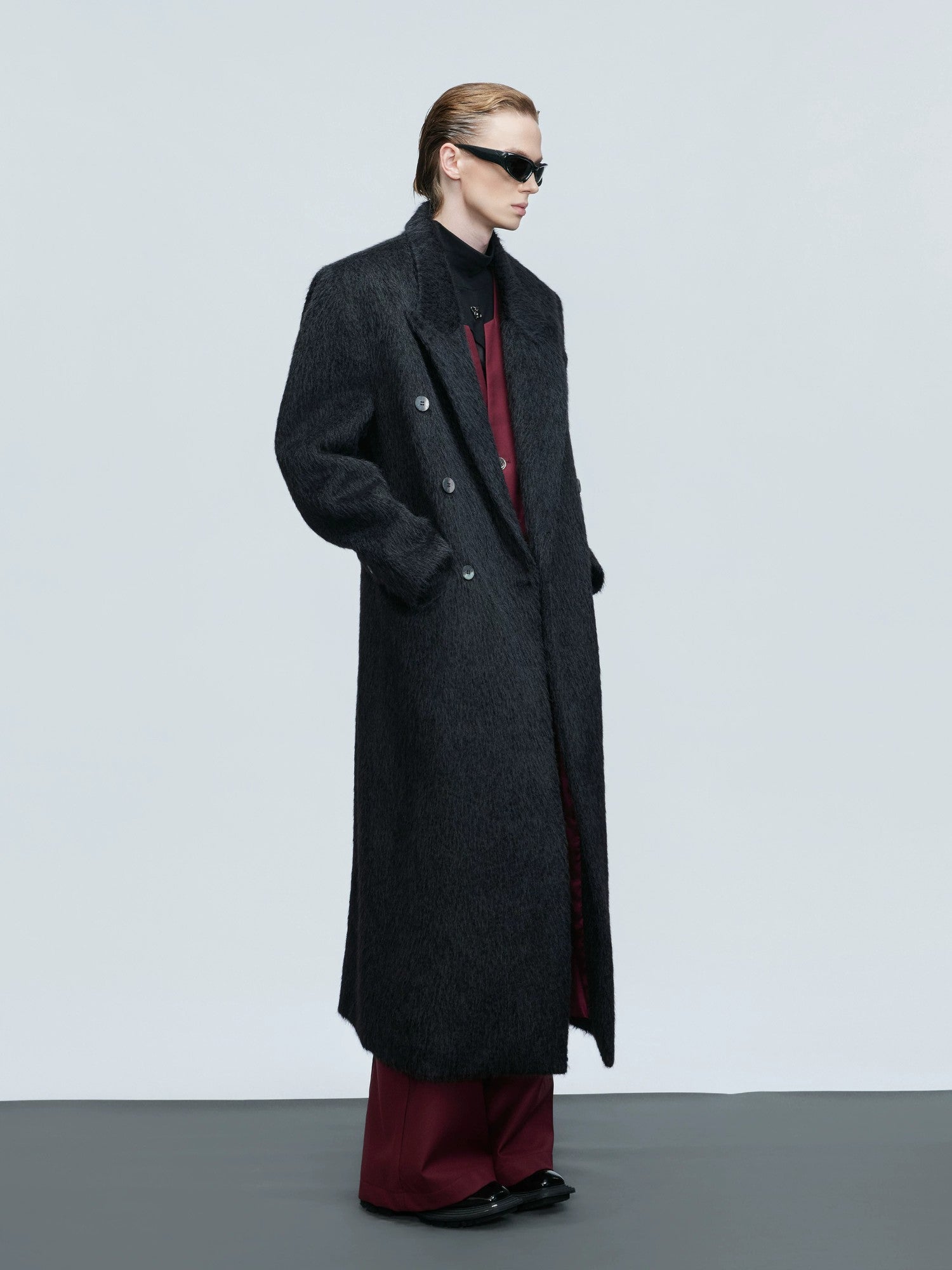 Side view of the brown long-line alpaca blend overcoat