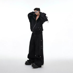 Close-up of the deconstructed drawstring design on a white streetwear hoodie