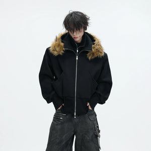 Front view of black deconstructed streetwear hoodie with zipper