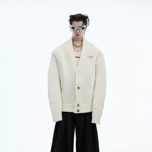 Front view of a loose fit heavyweight ribbed V-neck cardigan in vintage brown.