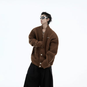 Back view showing the slouchy oversized silhouette of the knit cardigan.