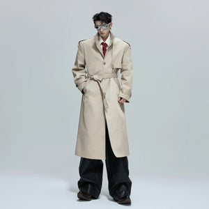 Side view of a khaki long trench coat with stand collar and loose fit