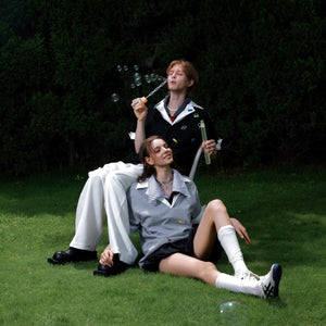 Detailed view of the deconstructed V-neck and faux two-piece collar