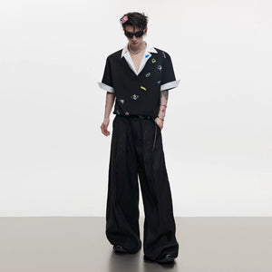 Back view of the gray raglan sleeve graphic polo shirt