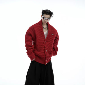 Model wearing a brown oversized V-neck knit cardigan with metal buttons