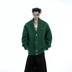 Close-up of premium metal buttons on a white chunky knit cardigan