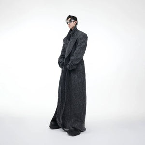 Back view of oversized woolen coat showing wide shoulder design