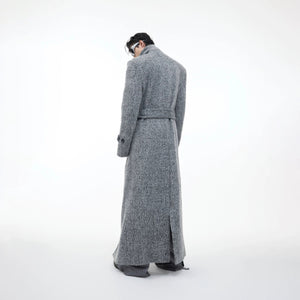 Model styling gray woolen trench coat with wide-leg pants