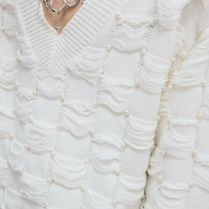 Premium 100% cotton knit texture with luxury pearl beading details.