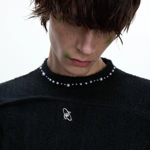 Model wearing slim fit long sleeve tee in urban setting