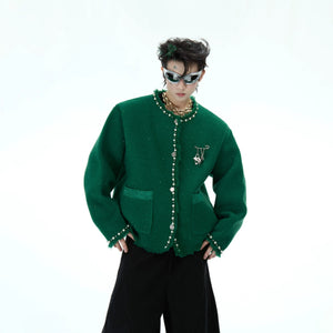 Detailed shot of the hand-stitched baroque pearls on the collar