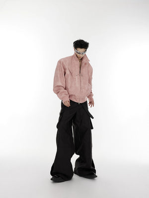 Lifestyle shot of a model wearing the pink polka dot moto jacket