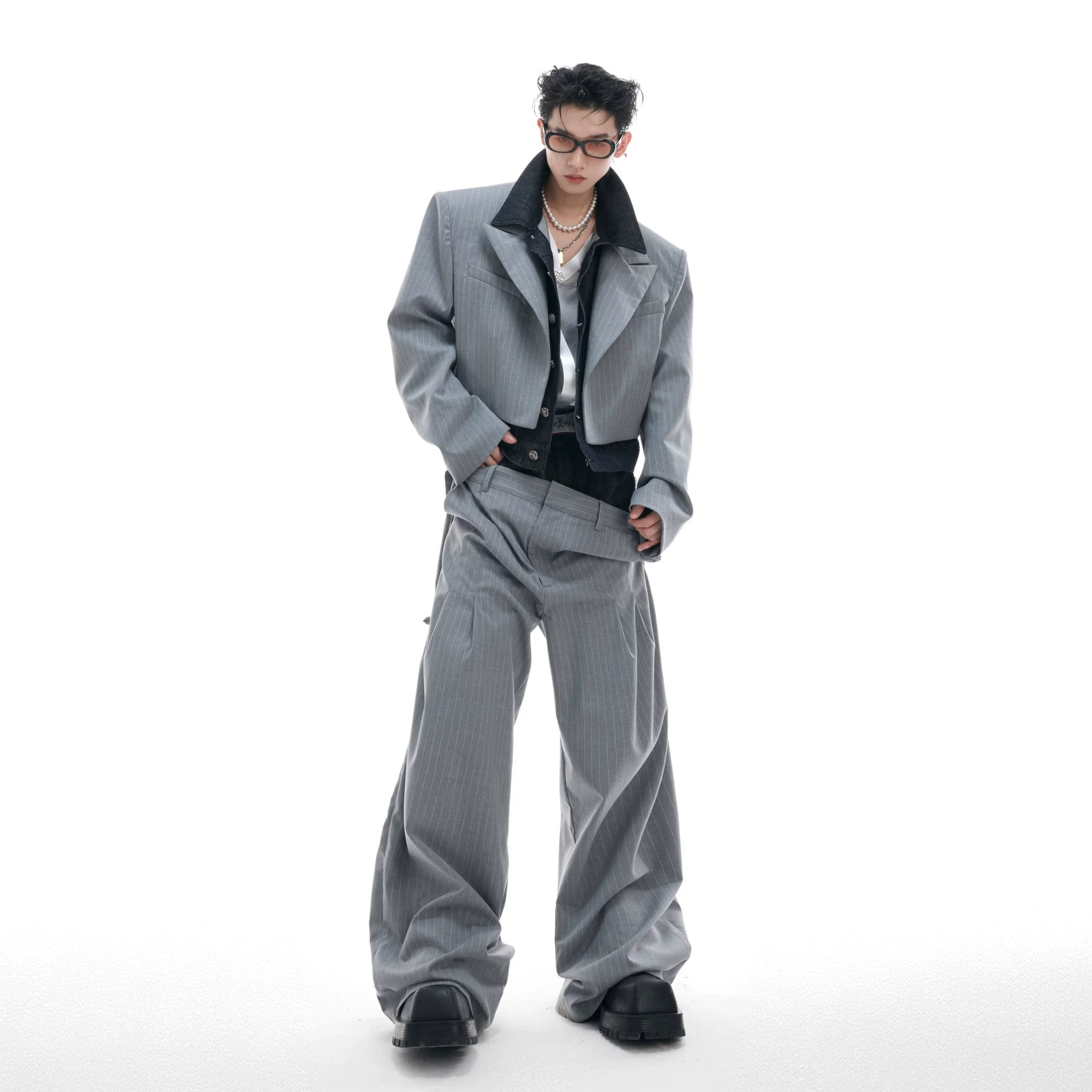 Men's deconstructed pinstripe blazer with denim patchwork details front view